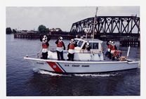 U.S. Coast Guard Auxiliary safety mascots wearing life jackets